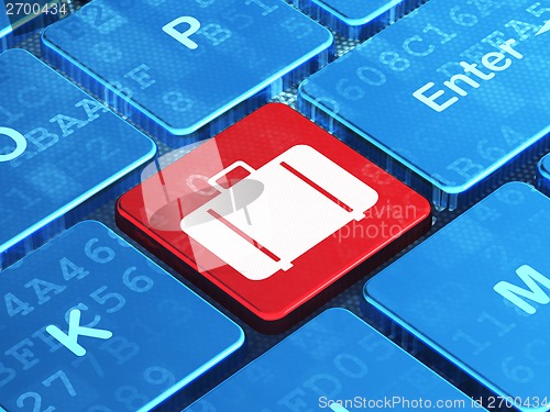 Image of Tourism concept: Bag on computer keyboard background
