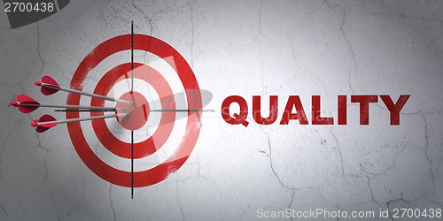 Image of Marketing concept: target and Quality on wall background
