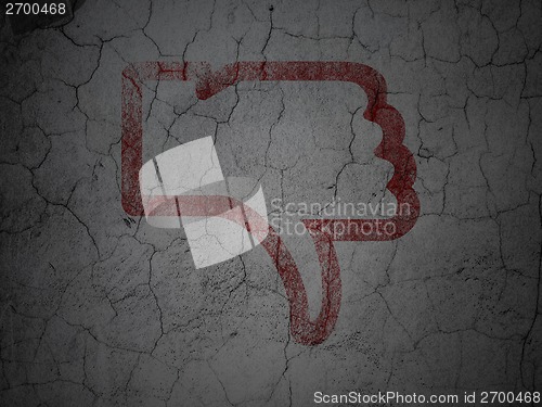 Image of Social network concept: Thumb Down on grunge wall background