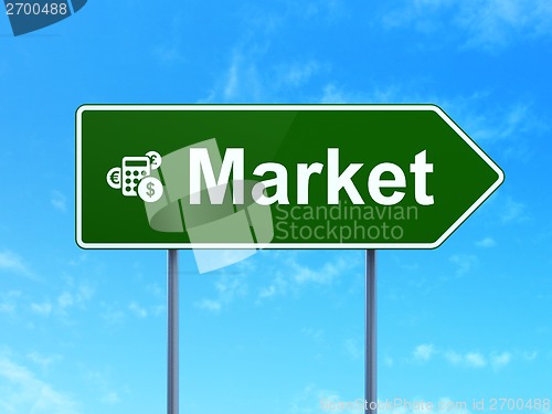 Image of Finance concept: Market and Calculator on road sign background