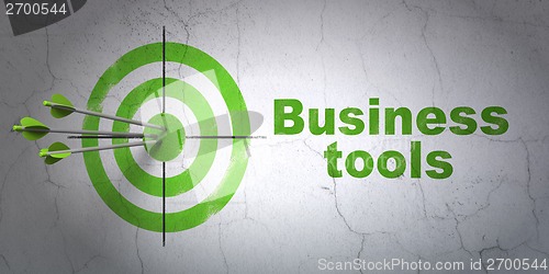Image of Business concept: target and Business Tools on wall background