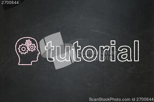 Image of Education concept: Head With Gears and Tutorial on chalkboard background