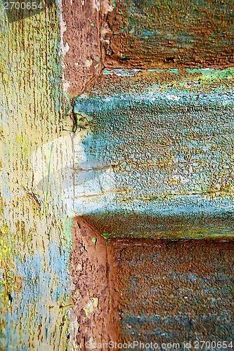 Image of colorated green wood as a window door 