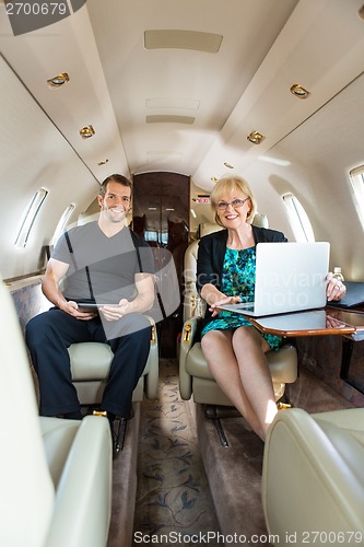 Image of Confident Business People In Corporate Jet