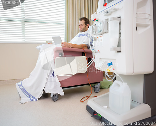 Image of Patient Using Digital Tablet at Dialysis Center