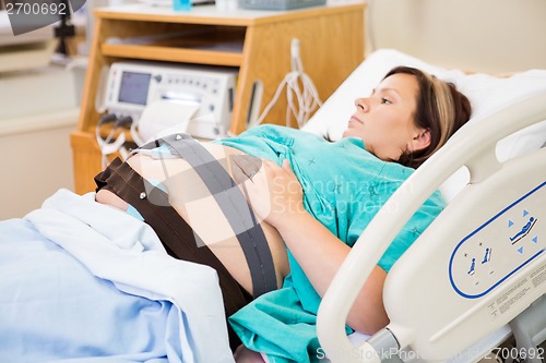 Image of Birthing Woman with Electronic Fetal Monitor Attached