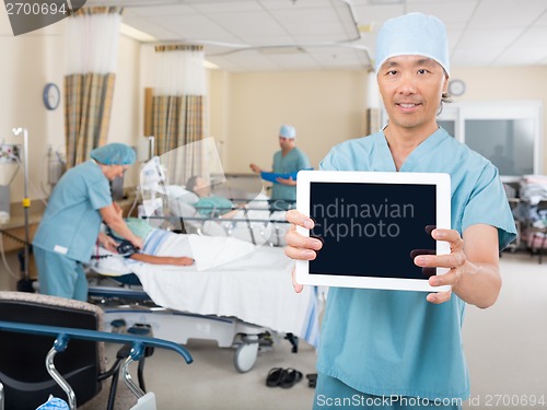 Image of Nurse Showing Digital Tablet In Ward