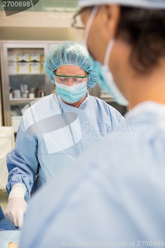 Image of Doctors Operating Patient