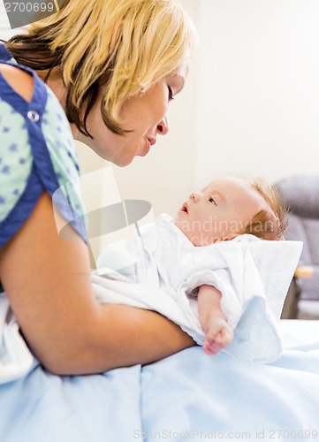 Image of Loving Woman Looking At Cute Babygirl In Hospital