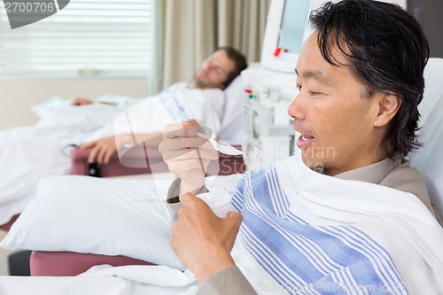 Image of Patient Eating Crushed Ice During Dialysis