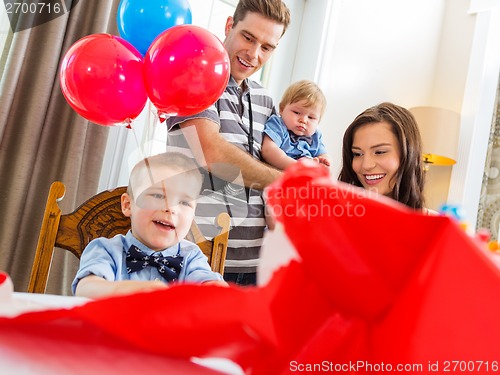 Image of Family Celebrating Son's Birthday