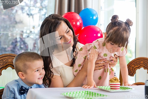 Image of Family Celebrating Girl's Birthday