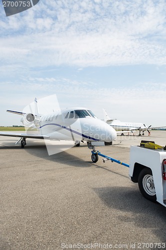 Image of Private Jet Being Towed