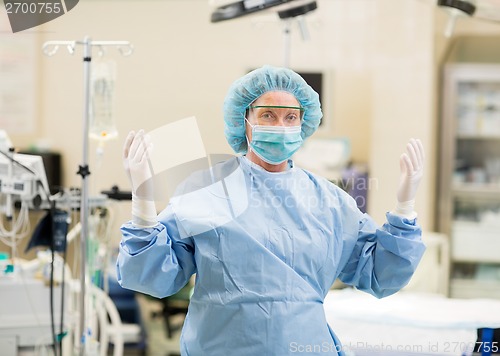 Image of Mature Doctor In Surgical Gown