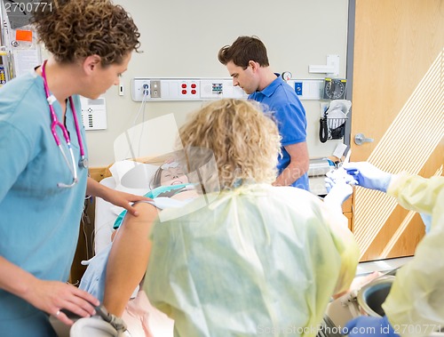 Image of Medical Team Delivering Baby