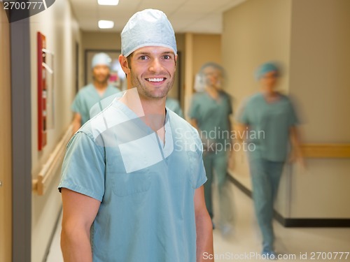 Image of Happy Doctor With Team At Hospital Corridor