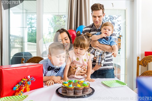 Image of Family Having Birthday Celebration At Home