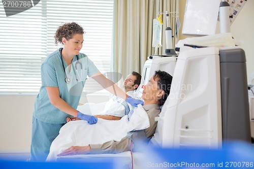 Image of Nurse Assisting Patient Undergoing Renal Dialysis