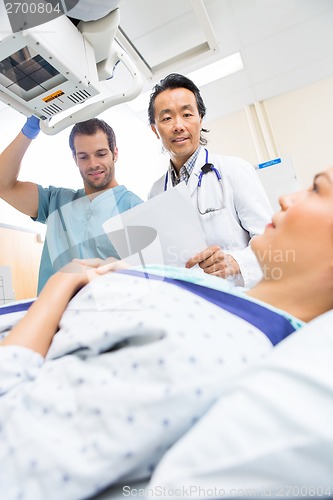 Image of Medical Team Preparing Patient In Xray Room