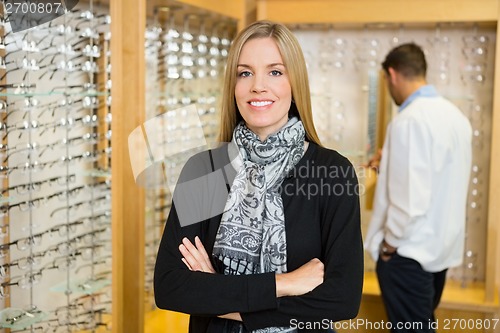 Image of Woman With Crossed Standing In Store
