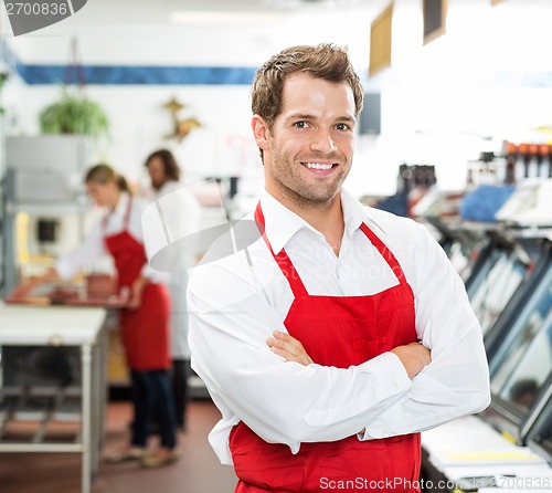 Image of Confident Male Butcher Standing Arms Crossed At Store