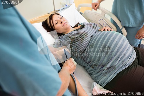 Image of Nurse Checking Pregnant Woman's Blood Pressure