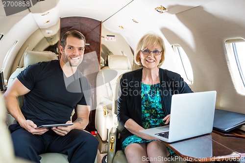 Image of Confident Business People On Private Jet