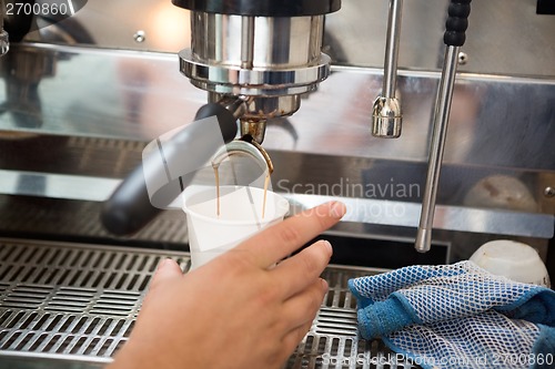 Image of Barista Making Coffee In Cafeteria