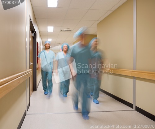 Image of Medical Team Walking In Hospital Corridor