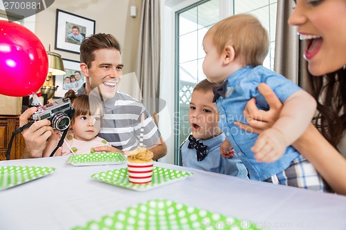 Image of Family Celebrating Son's Birthday
