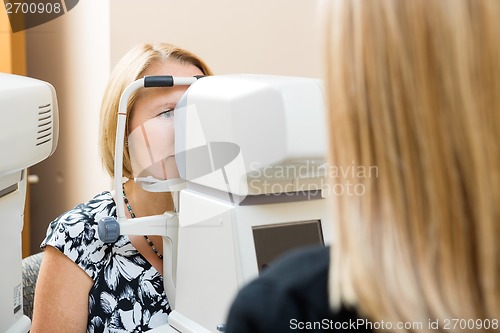 Image of Optometrist Using Tonometer to Measure Patients Eye Pressure