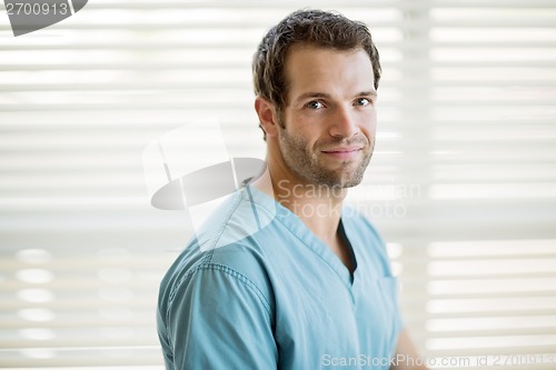 Image of Male Nurse Smiling At Clinic