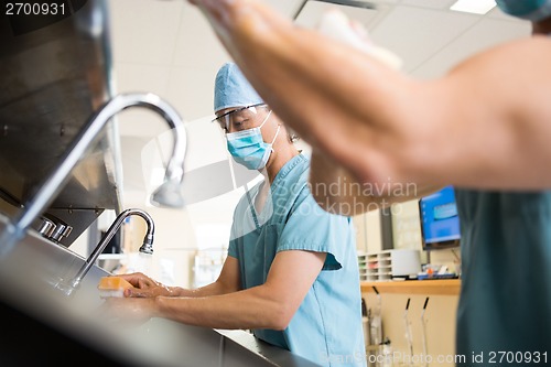 Image of Surgeons Scurbbing Hands and Arms