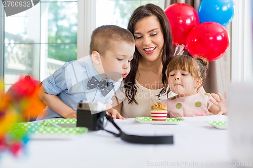 Image of Family Celebrating Boy's Birthday