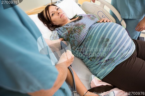 Image of Nurse Taking Pregnant Woman's Blood Pressure