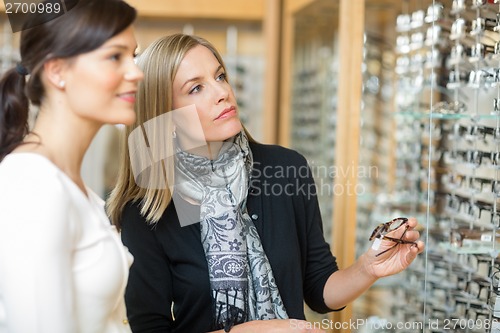 Image of Woman With Salesgirl Selecting Eyeglasses