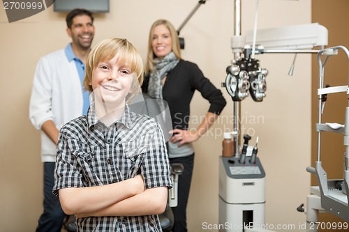 Image of Happy Boy With Optometrists At Store