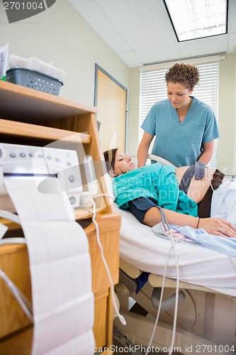 Image of Nurse Examining Pregnant Woman