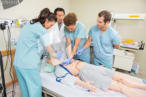 Image of Medical Team Performing CPR On Dummy Patient