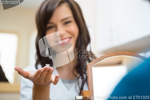 Image of Female Optometrist Showing Contact Lens