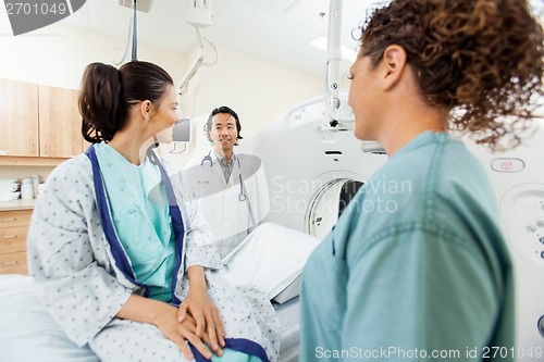 Image of Patient With Medical Team In CT Scan Room