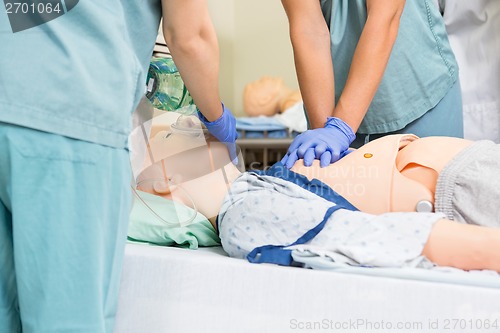 Image of Nurse Performing CPR On Dummy Patient