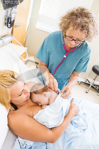 Image of Nurse Examining Babygirl With Stethoscope In Hospital