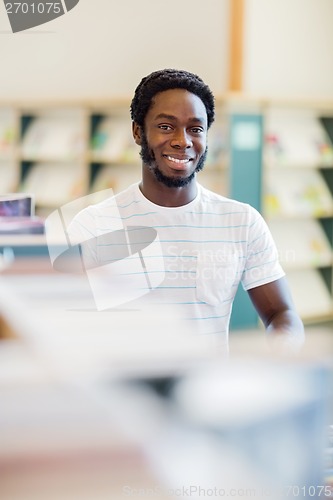 Image of Librarian Smiling In Bookstore