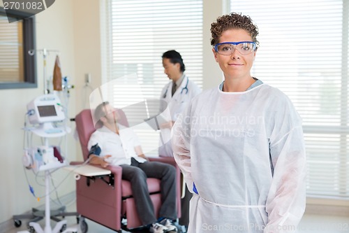 Image of Nurse With Doctor Examining Patient's Heartbeat