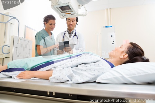 Image of Medical Team With Patient In Hospital Room