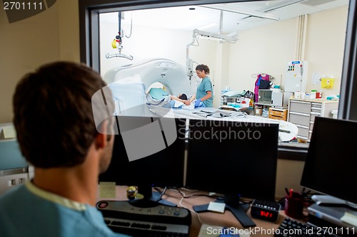 Image of Radiologist Working In CT Scan Lab