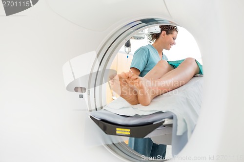 Image of Nurse Looking Patient Undergoing CT Scan