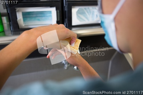 Image of Surgeon Washing Hands At Washbasin