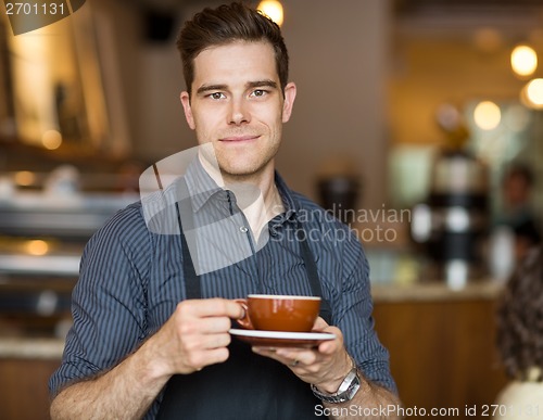 Image of Barista with Coffee Cup